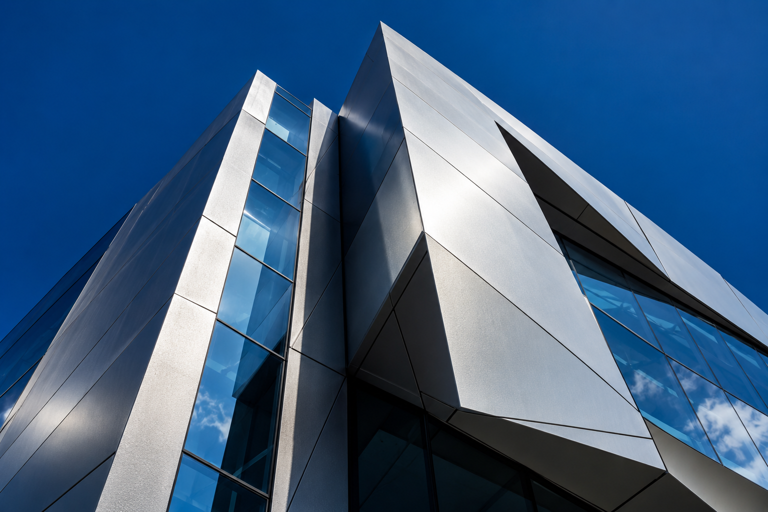 Architectural illustration of a contemporary facade with silver cladding and reflective glass
